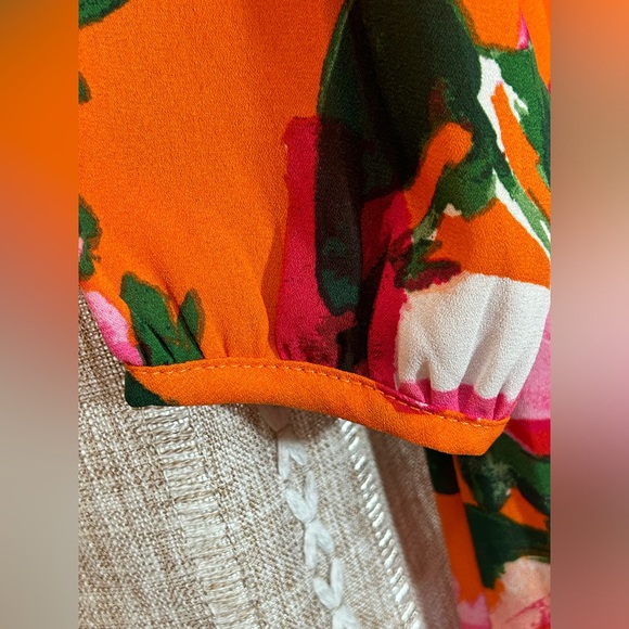 Lulu’s Sweetest Song Orange and Pink Floral Print Backless Long Sleeve Romper. - Picture 6 of 10